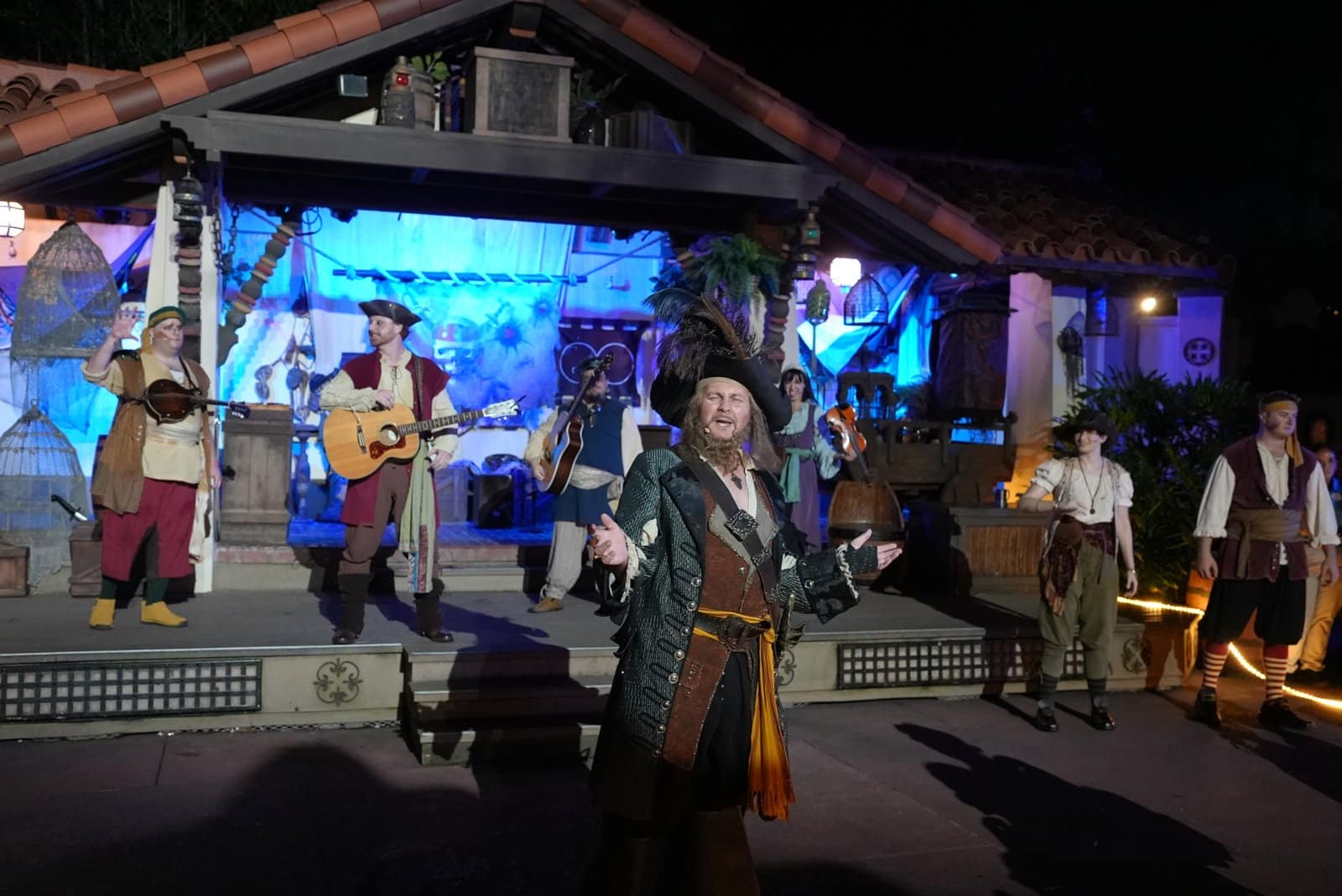 Captain Barbossa on stage at Mickey's Not-So-Scary Halloween Party with the pirate band behind him