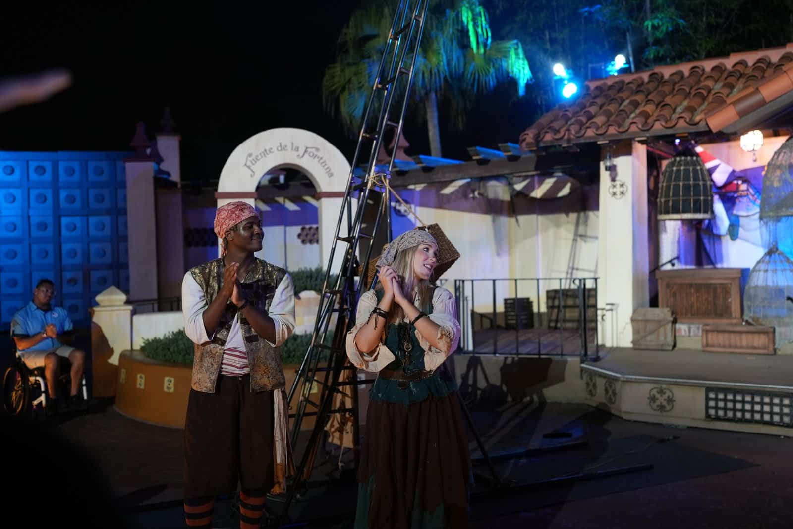Two pirate crew members leading the audience during the show