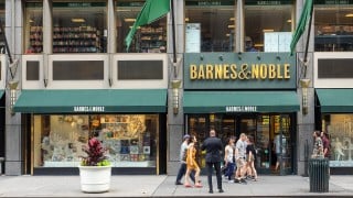 A Barnes & Noble storefront on Fifth Avenue in New York, with shoppers walking past the entrance