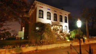 The Lemp Mansion in St. Louis lit at dusk