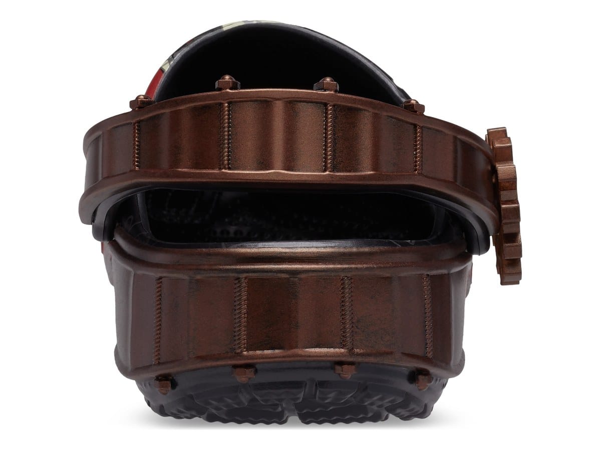 Rear view of the Saw Billy Classic Clog with a bronze heel strap and sole shaped like the reverse bear trap