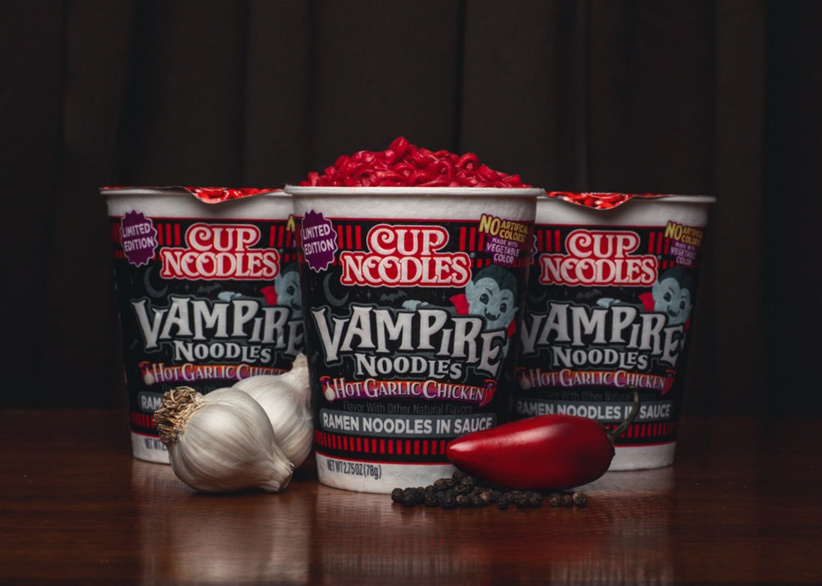 Three Cup Noodles Vampire Noodles cups with blood-red noodles, garlic, and a red chili