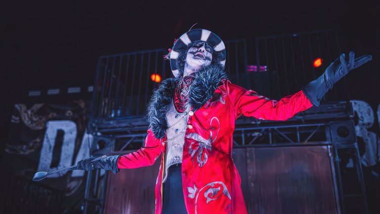 Immersive performers engage guests in story-driven scenes during the Queen Mary’s Dark Masquerade experience.