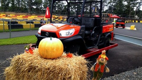 Fall decorations, a pumpkin, and a Kubota utility vehicle at Diggerland USA's Diggerfest