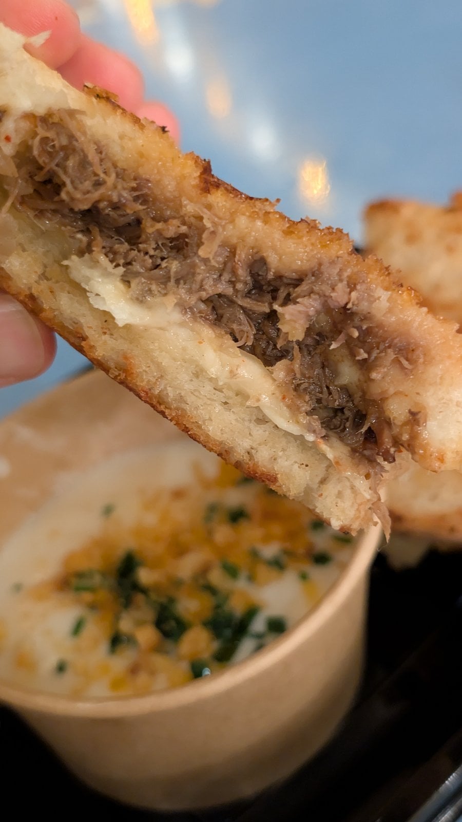 The inside of the BooGogi Beef Toasted sandwich with corn cheese soup