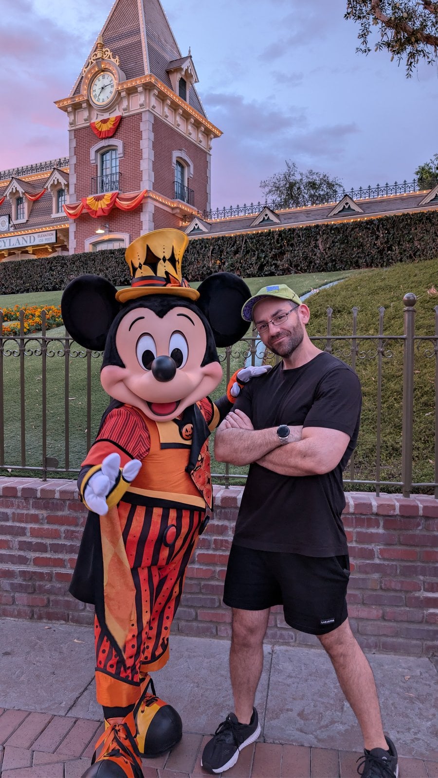 Philip Hernandez with Mickey Mouse in his 2026 Halloween outfit at the Disneyland entrance
