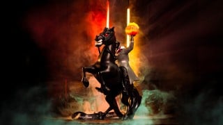 The Headless Horseman popcorn bucket at Disneyland, the rider on a rearing black horse holding a glowing jack-o'-lantern