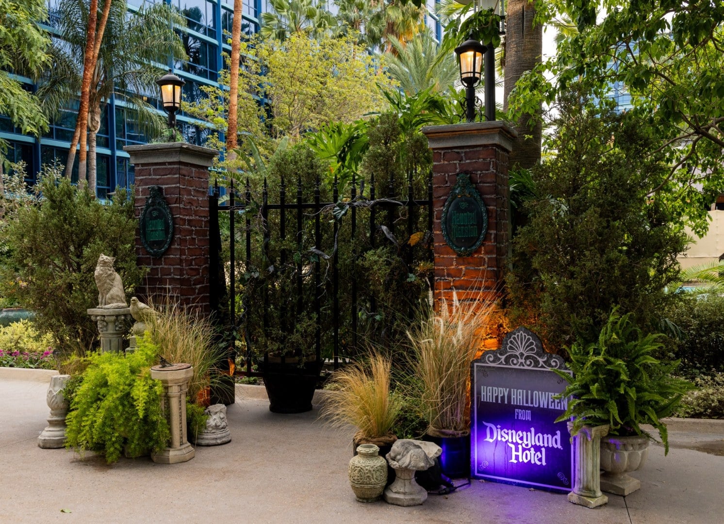 Haunted Mansion-style wrought iron gates photo spot at the Disneyland Hotel for Halloween Time 2026