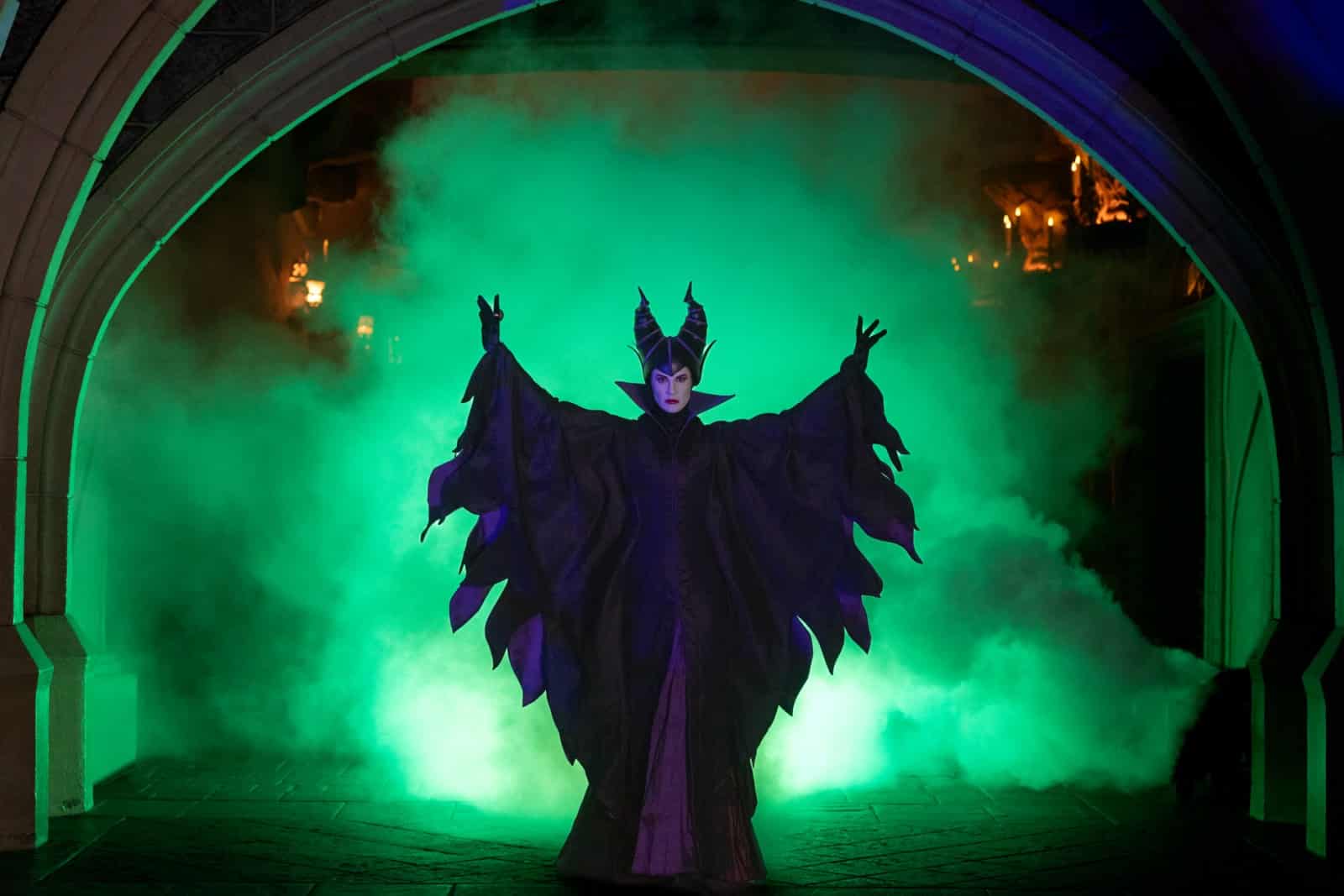 Maleficent in green smoke at Disneyland Paris during the Disney Halloween Festival