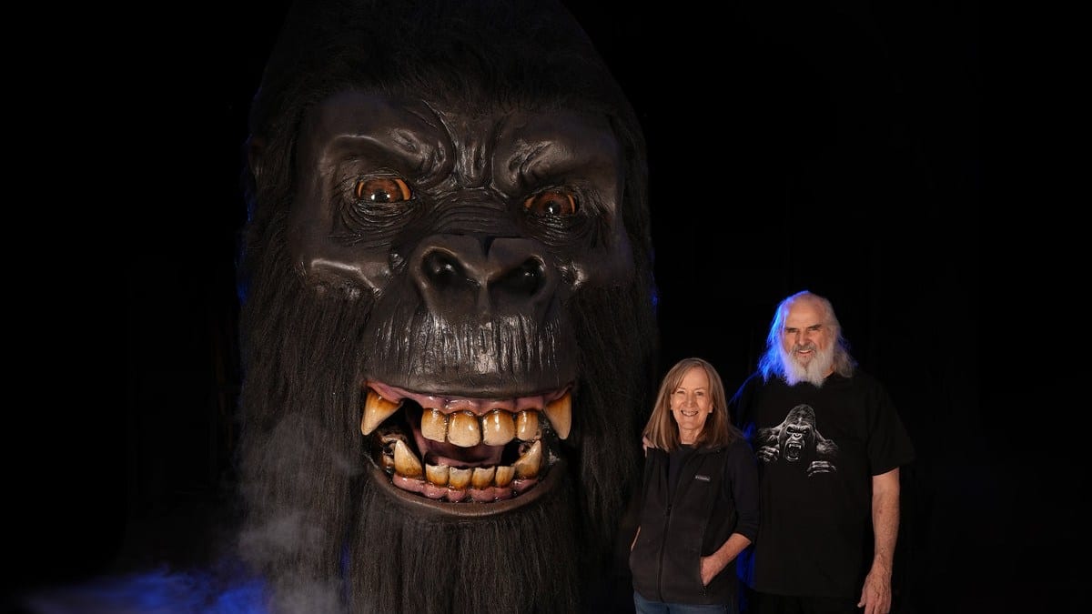 Distortions Unlimited Kong animatronic gorilla head with Ed and Marsha Edmunds standing beside it