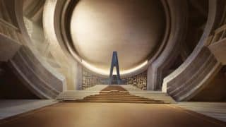 A circular stone hall with wide steps leading up to a tall, narrow blue throne, a promotional image for DUNE: The Experience