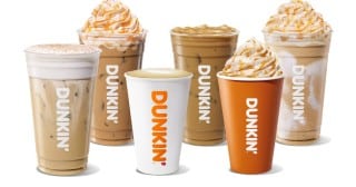 Dunkin's 2026 fall pumpkin beverage lineup, five drinks topped with whipped cream and caramel