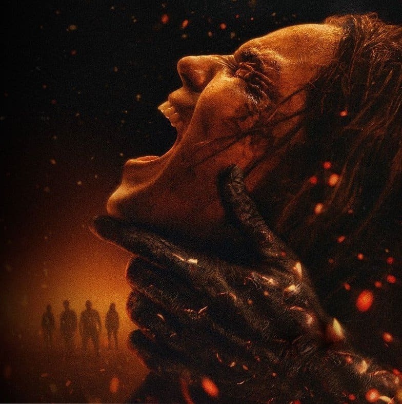 A Deadite hand grips a screaming woman's face in key art for Evil Dead Burn