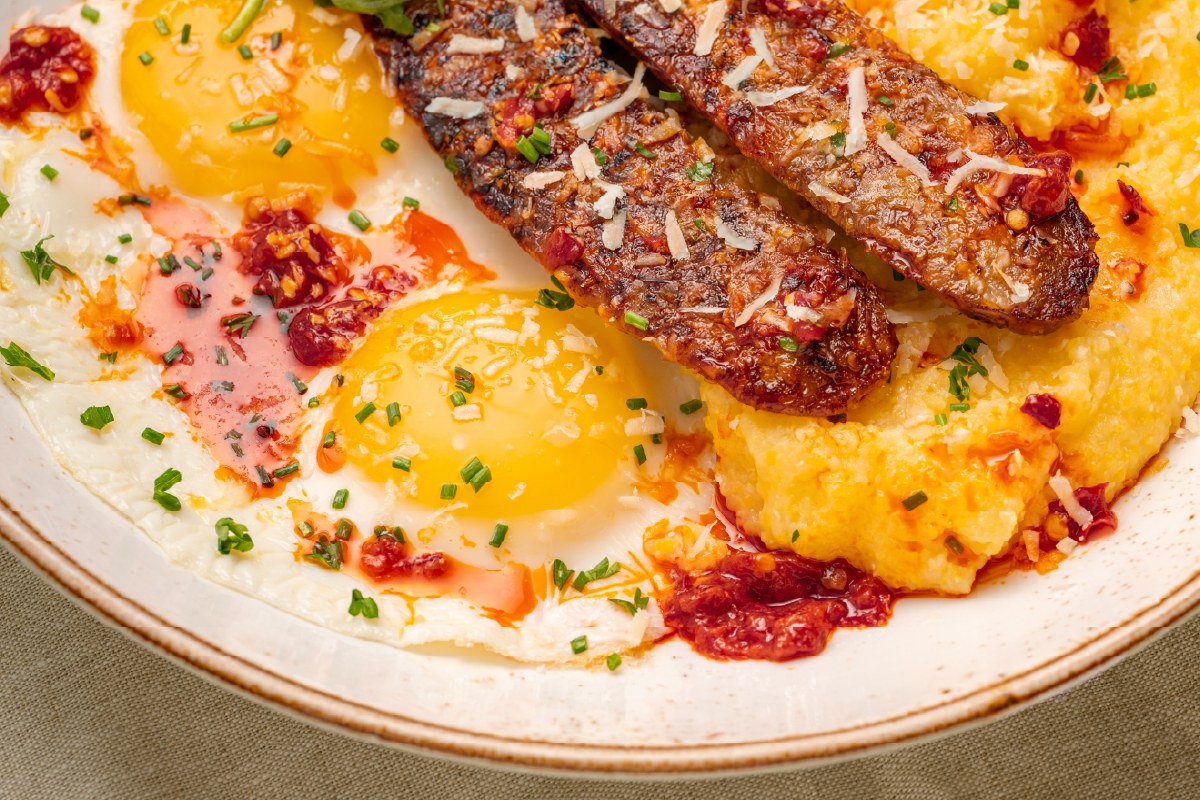 First Watch The Godfather Breakfast Bowl with Italian sausage, eggs, grits, arugula, and Parmesan