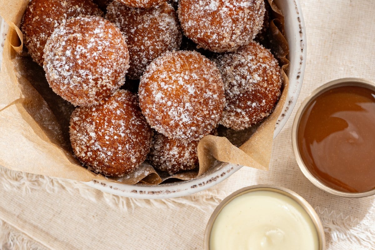 First Watch Pumpkin Spice Donuts, warm cake donut holes in pumpkin-spiced sugar with salted caramel and creme anglaise for dipping