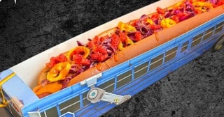 The Fortnitemares Battle Bus Dog, a 22-inch hot dog served in a Fortnite Battle Bus tray