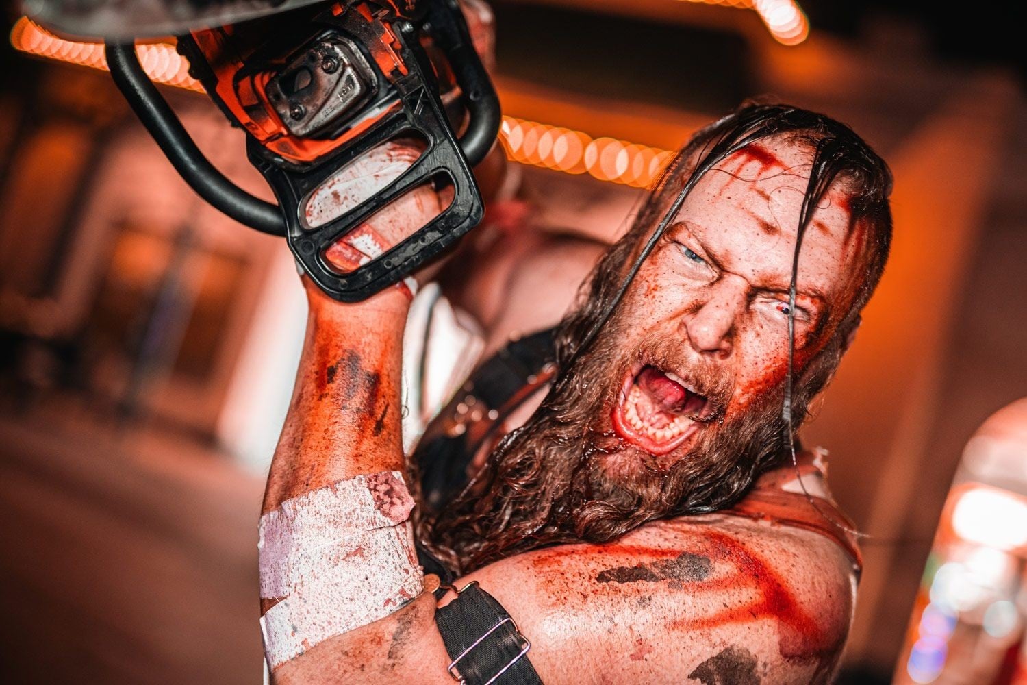 A bloodied chainsaw-wielding scareactor at Six Flags Great America Fright Fest