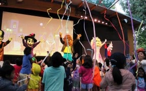Costumed characters and children in costume at The Great Big BOO stage show at Gilroy Gardens