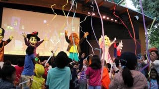 Costumed characters and children in costume at The Great Big BOO stage show at Gilroy Gardens