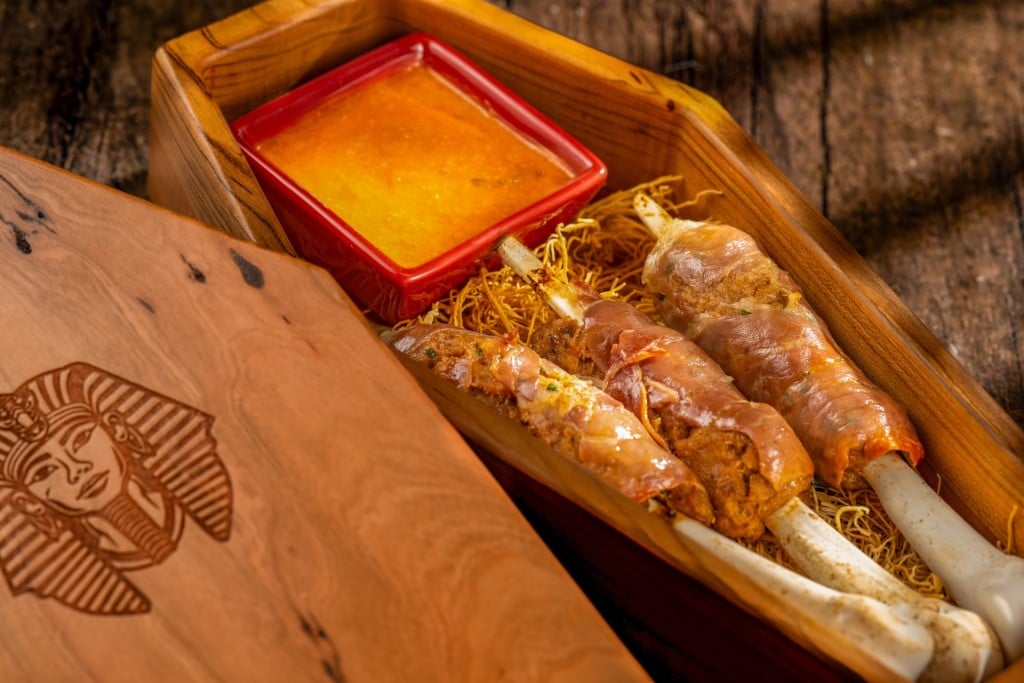 The Bone Kebabs at Jock Lindsey's Hangar Bar: pork and beef bone kebabs with prosciutto and creamy tomato sauce