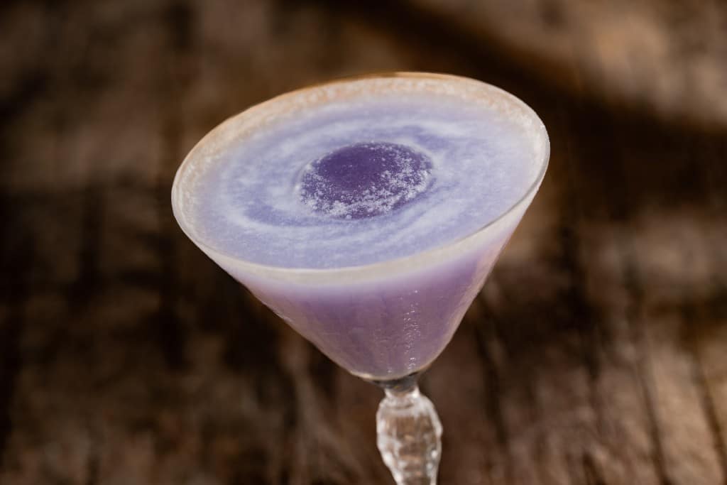 The Midnight Relic cocktail at Jock Lindsey's Hangar Bar: Tito's vodka, ube syrup, cream of coconut, and edible glitter
