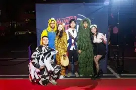 Costumed guests in front of the Haunted Little Tokyo backdrop in Los Angeles