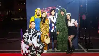 Costumed guests in front of the Haunted Little Tokyo backdrop in Los Angeles