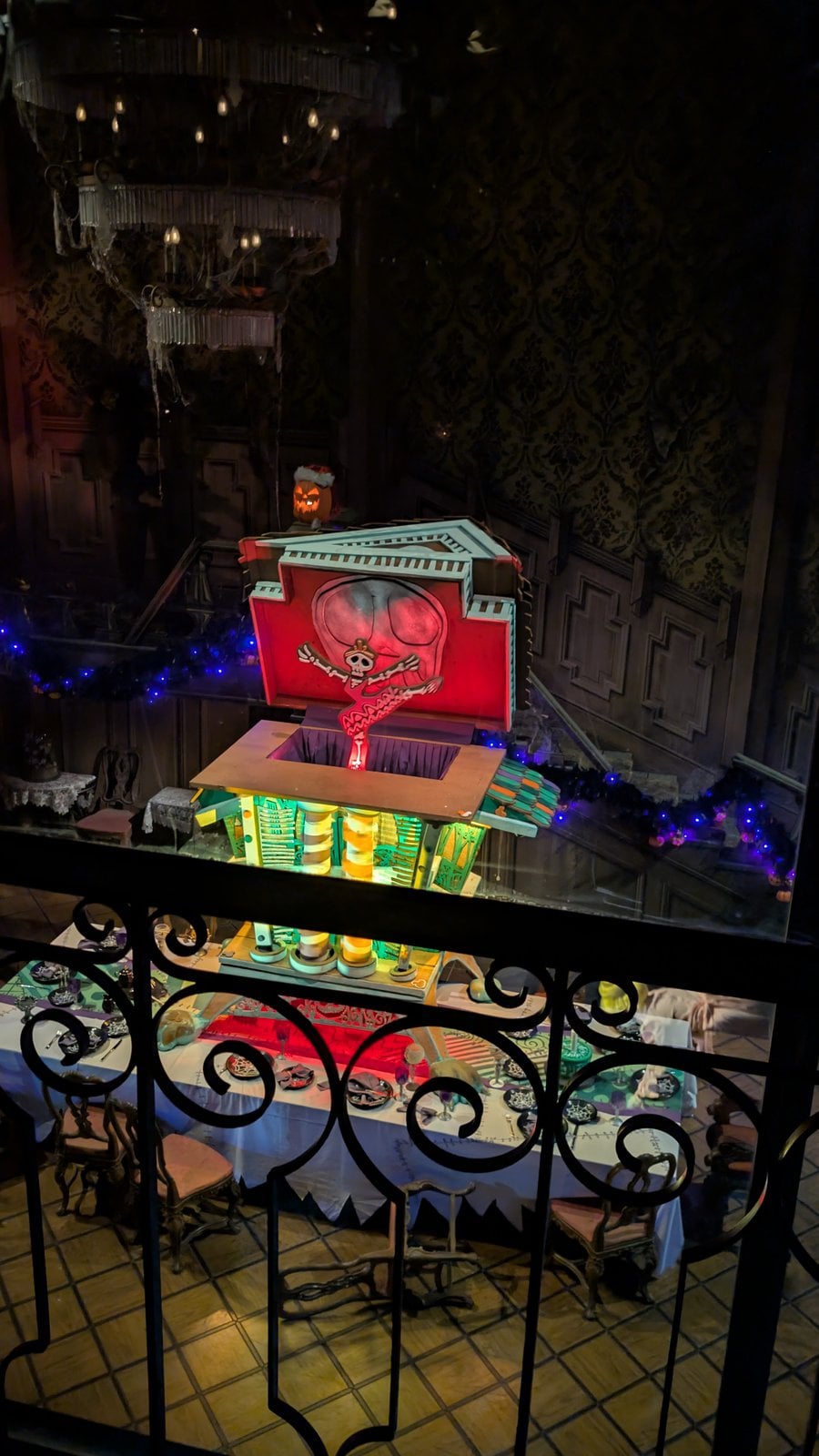 The 2026 gingerbread music box on the ballroom table in Haunted Mansion Holiday at Disneyland