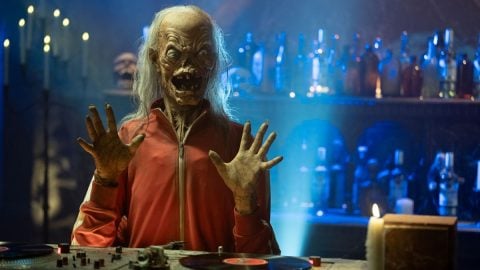 The new Crypt Keeper puppet in a red tracksuit at a DJ booth, promoting AMC's FearFest 2026