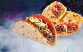 Fuzzy's Taco Shop Draco Taco II and the new Draco'rrito against a haunted-house backdrop