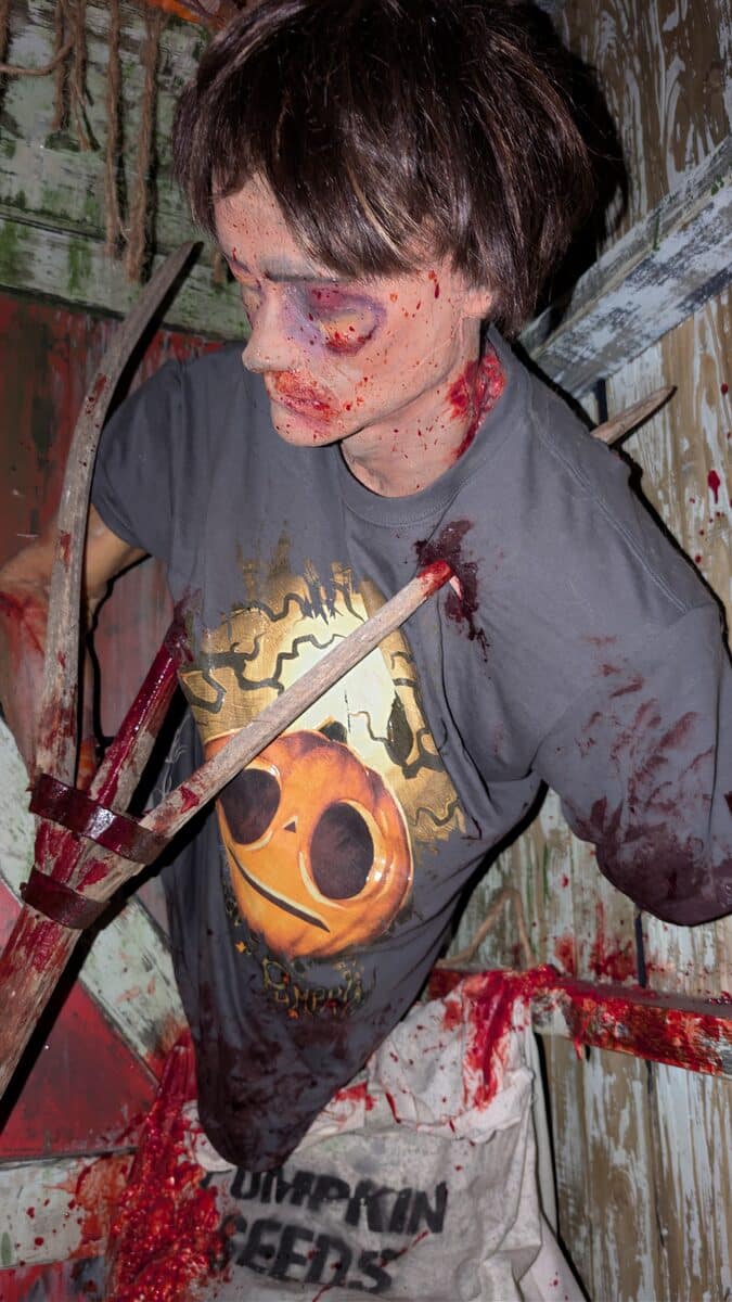 Scareactor in a Pumpkin Guts shirt holding a carved pumpkin