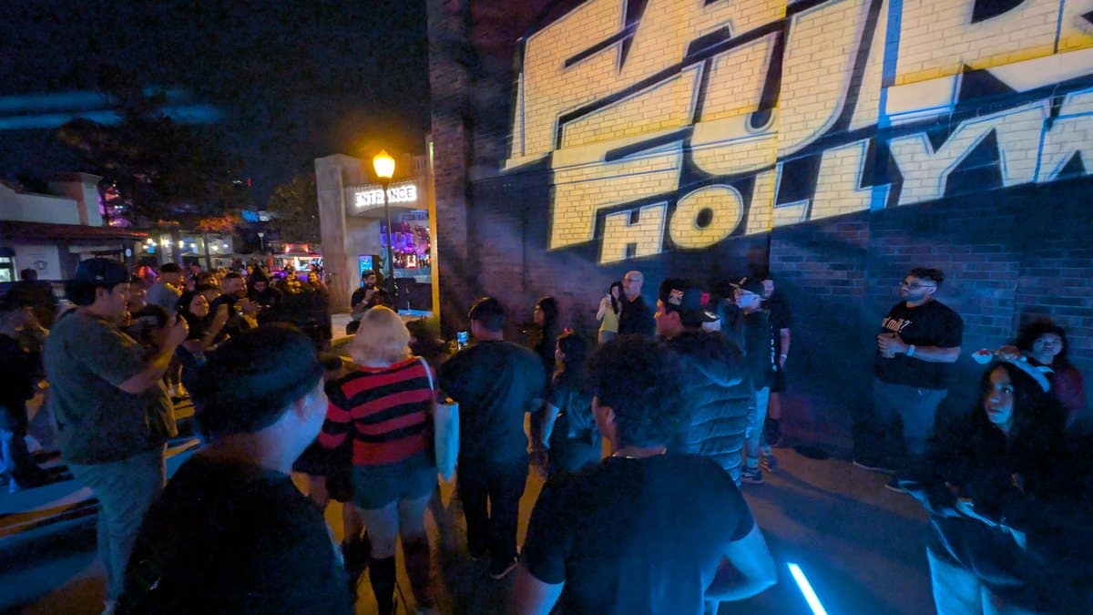 Guests crowding around Obsession's Freaky Nikki at Halloween Horror Nights Hollywood