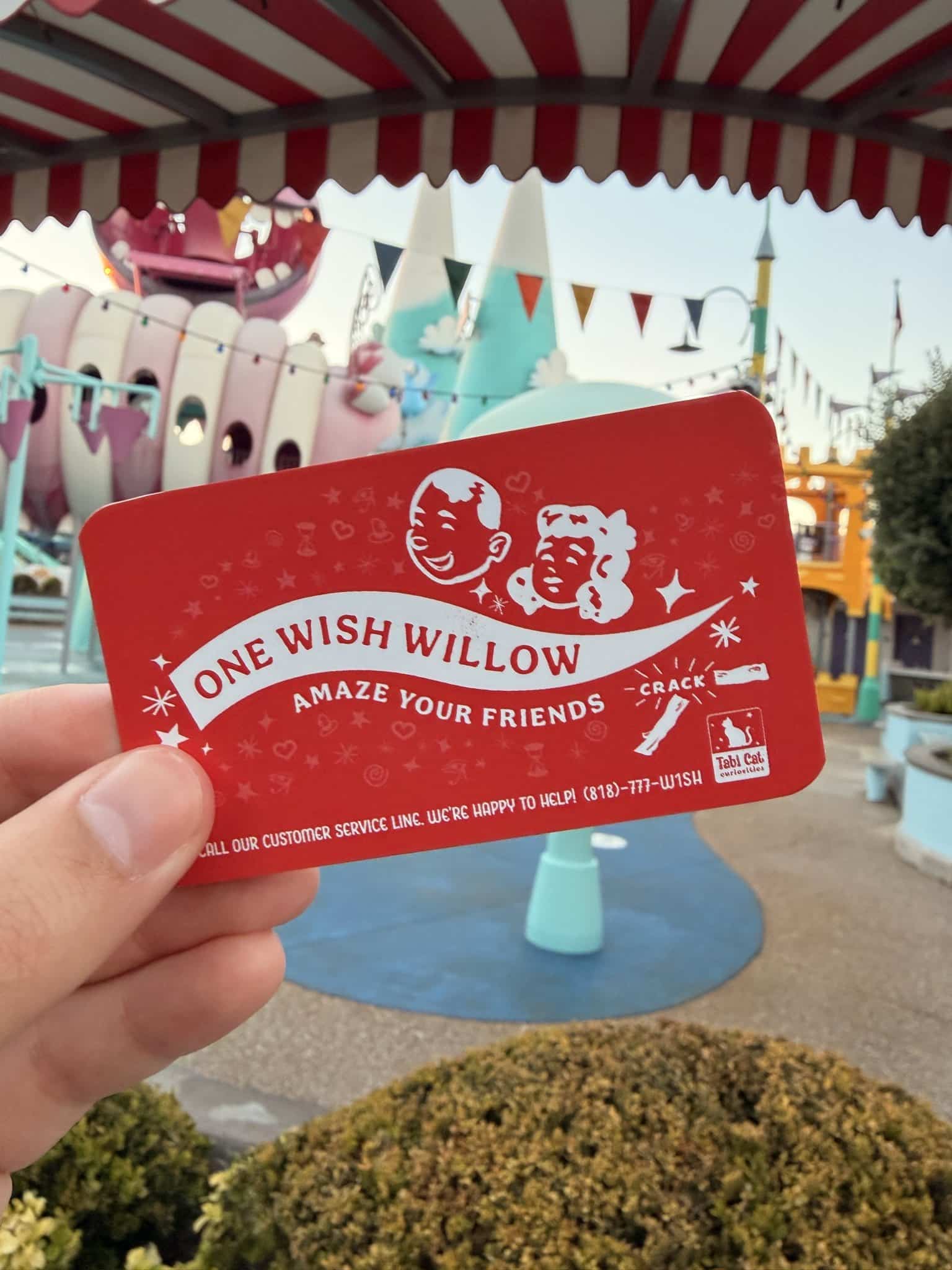 A red One Wish Willow card that Obsession's Freaky Nikki hands out at Halloween Horror Nights Hollywood