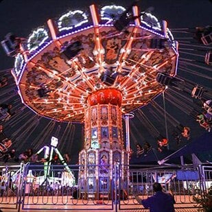 The lit carnival midway at House of Horror Haunted Carnival