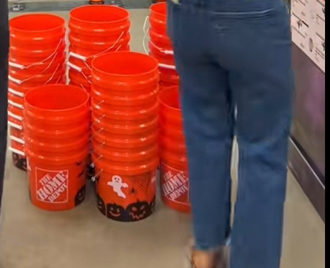 Close-up of Home Depot Halloween print buckets with ghost and jack-o-lantern band