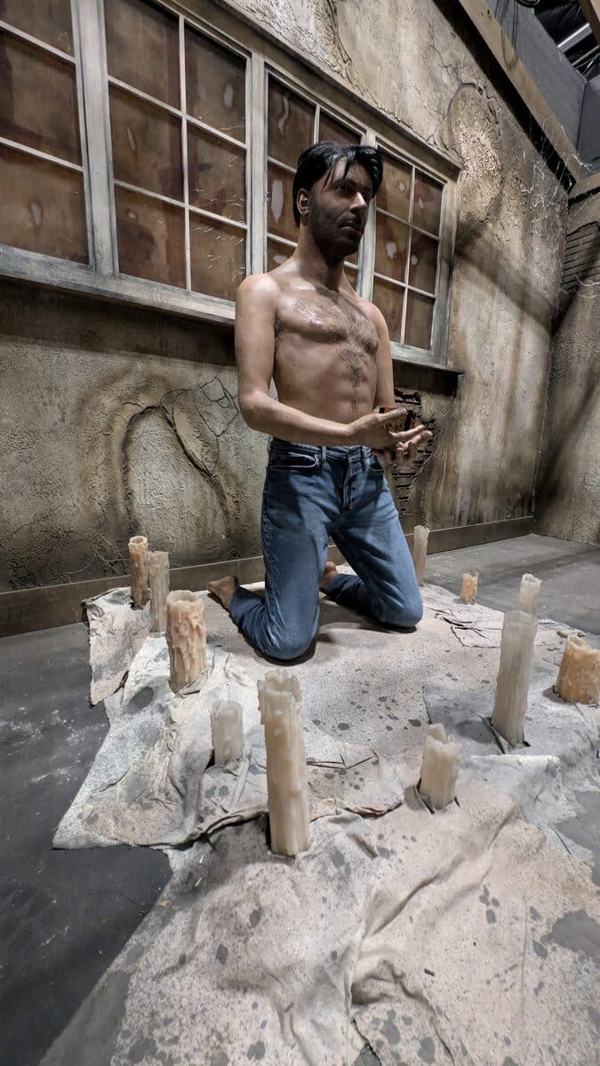 Frank Cotton kneels among candles solving the Lament Configuration in the HHN Hellraiser house