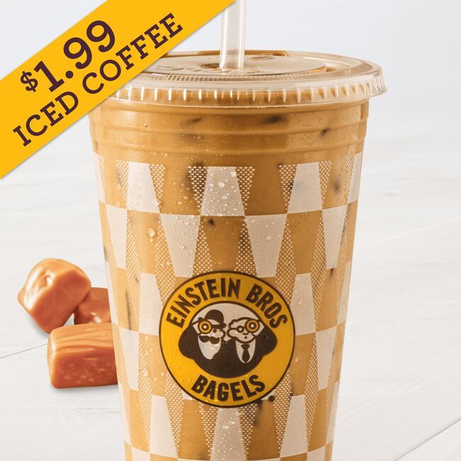 Einstein Bros. Creme Brulee Iced Coffee in a checkered cup