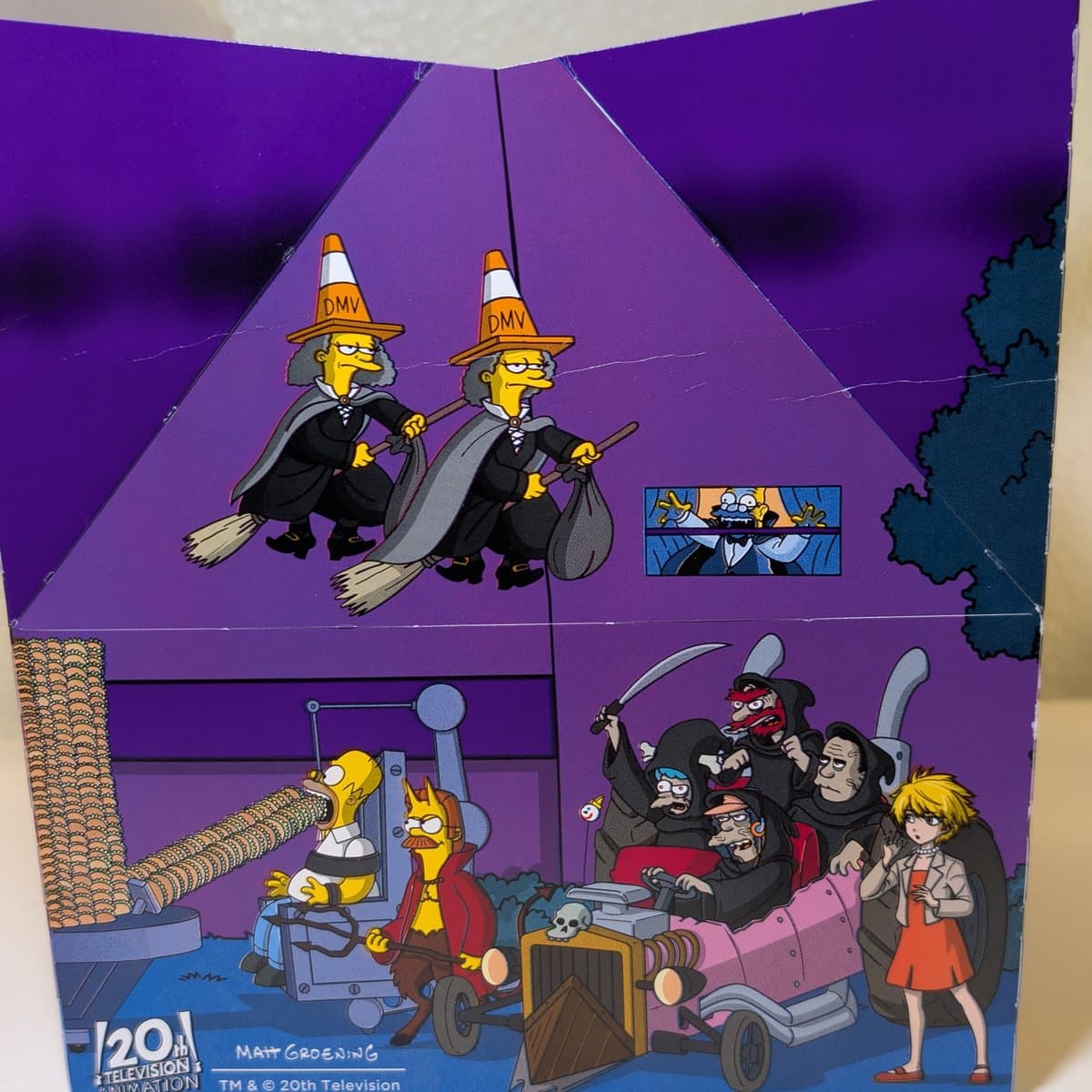 Munchie Meal of Horror box art of Homer being fed tacos while Devil Flanders watches