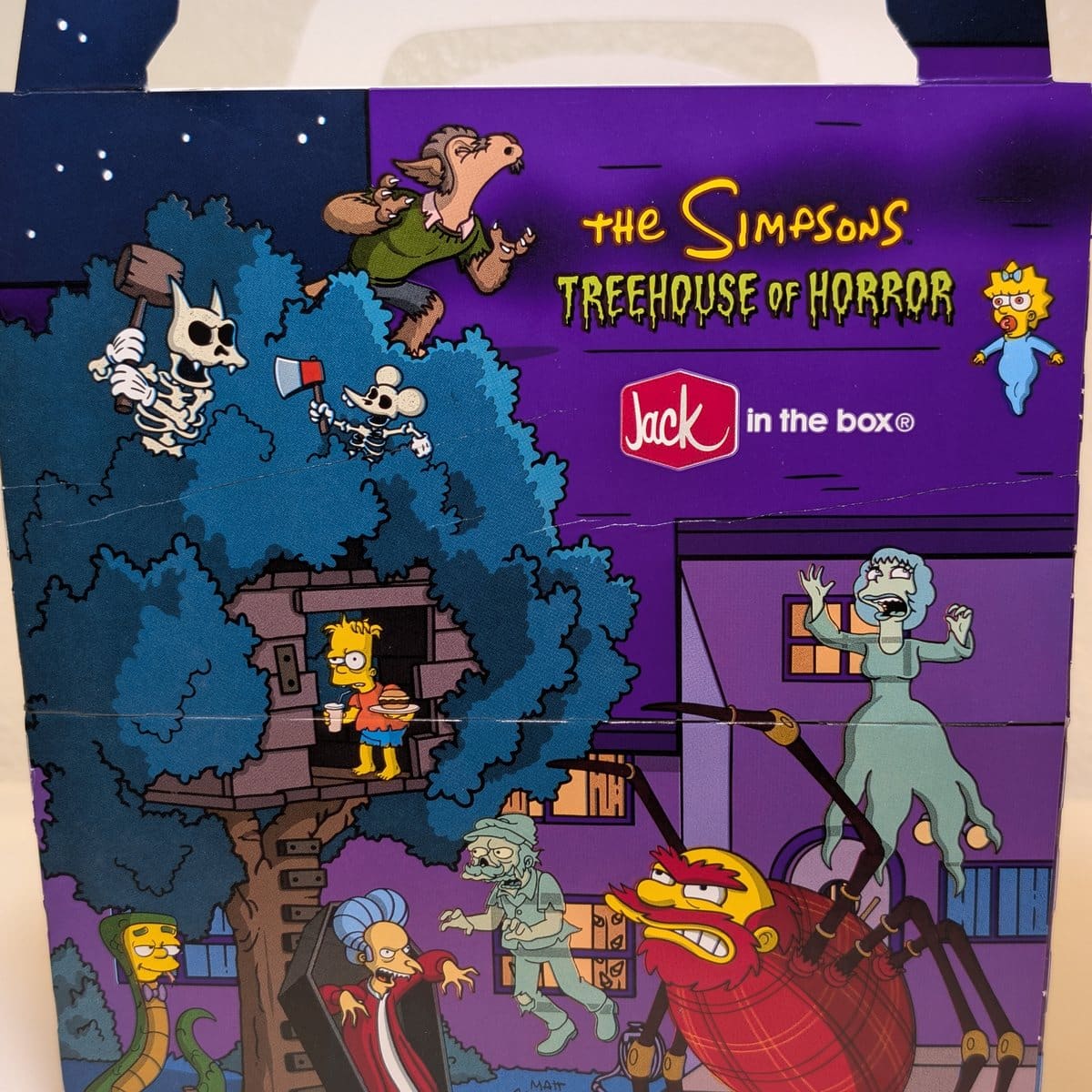 Munchie Meal of Horror box art with Bart's treehouse, Mr. Burns as Dracula, and Willie as a spider