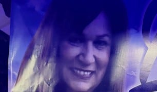 Laurie, a member of the Woods of Terror family, smiling