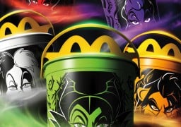 Five McDonald's Boo Buckets with yellow Golden Arches lids, printed with the faces of Jafar on red, Ursula on purple, Cruella on white, Maleficent on green and Scar on orange