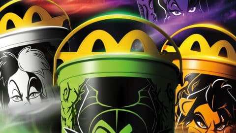 Five McDonald's Boo Buckets with yellow Golden Arches lids, printed with the faces of Jafar on red, Ursula on purple, Cruella on white, Maleficent on green and Scar on orange