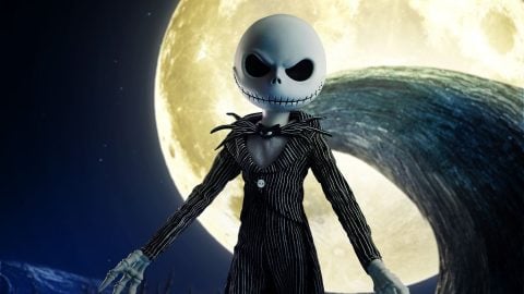 Mezco's LDD Presents Jack Skellington doll in his pinstriped suit, in front of a full moon and Spiral Hill