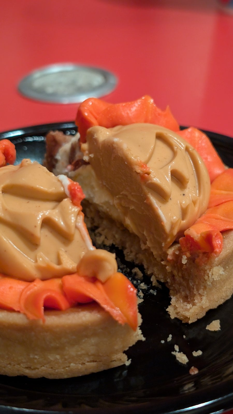 The Headless Horseman Treat cut in half, showing the tart shell and whipped cheesecake
