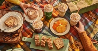 Panera fall menu spread with Pumpkin Spice Latte, Frozen Java, pumpkin cookies, cinnamon roll, and pumpkin bread