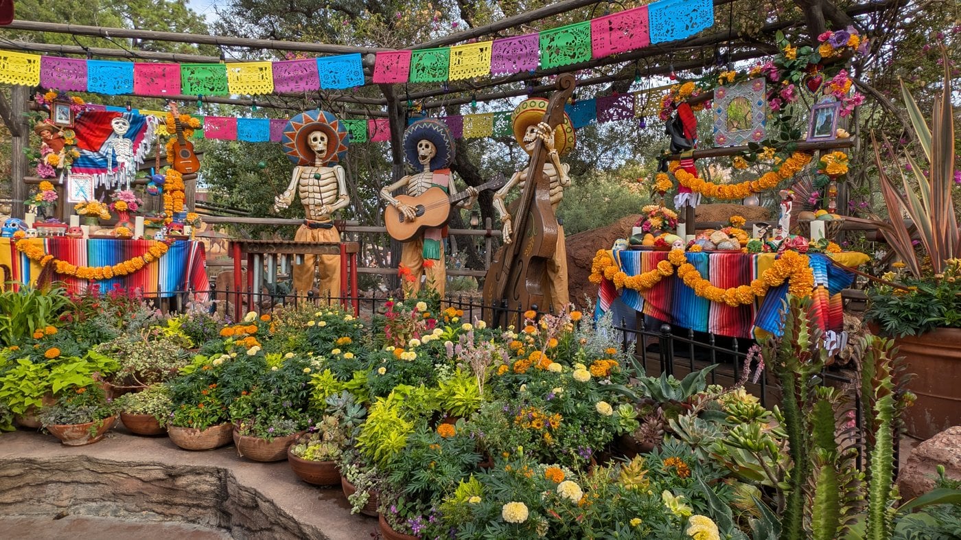 Plaza de la Familia decor with calaca figures and papel picado at Disney California Adventure