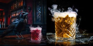 A raven beside a smoking red cocktail at a dark bar, next to a smoking amber cocktail