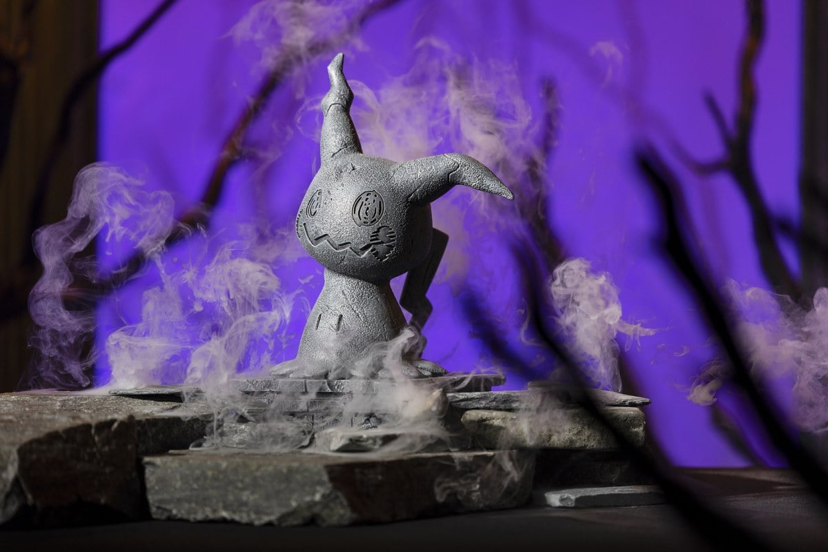 Pokémon Center Mimikyu Halloween stone-look yard statue on a cracked pedestal