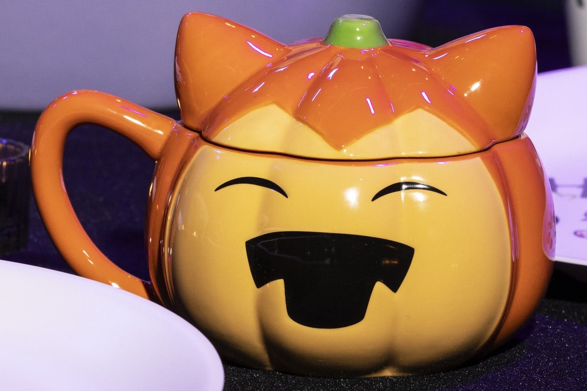 Pokémon Center pumpkin ceramic mug with a jack-o-lantern face