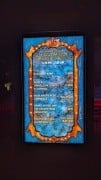 A Halloween Horror Nights 35 attraction board showing five-minute waits during Premium Scream Night